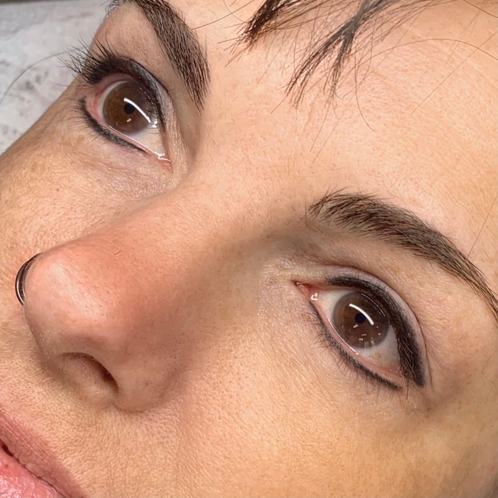 Finished permanent eyeliner results enhancing the eyes after treatment at Painted Lady Studios in Syracuse NY.